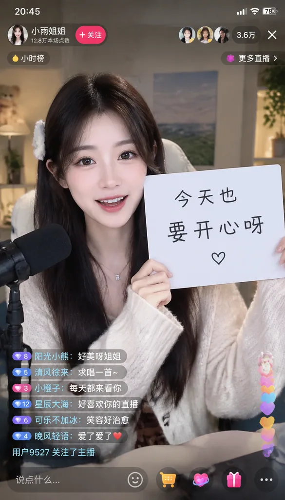 Vertical live stream screenshot of a host holding up a handwritten sign with viewer comments