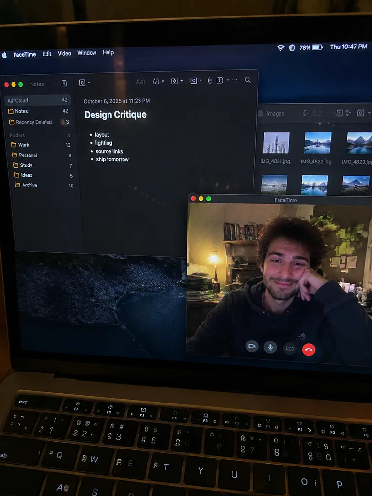 Phone photo of a laptop screen showing a video call at night, with moire and glare